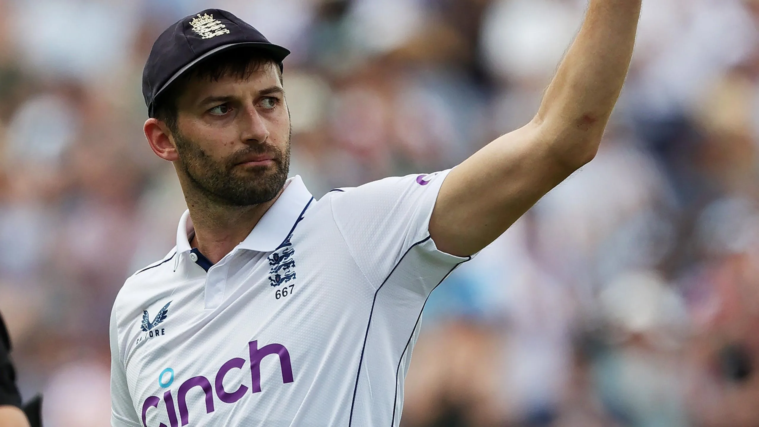Mark Wood waves to the crowd after leaving the field during a Test match