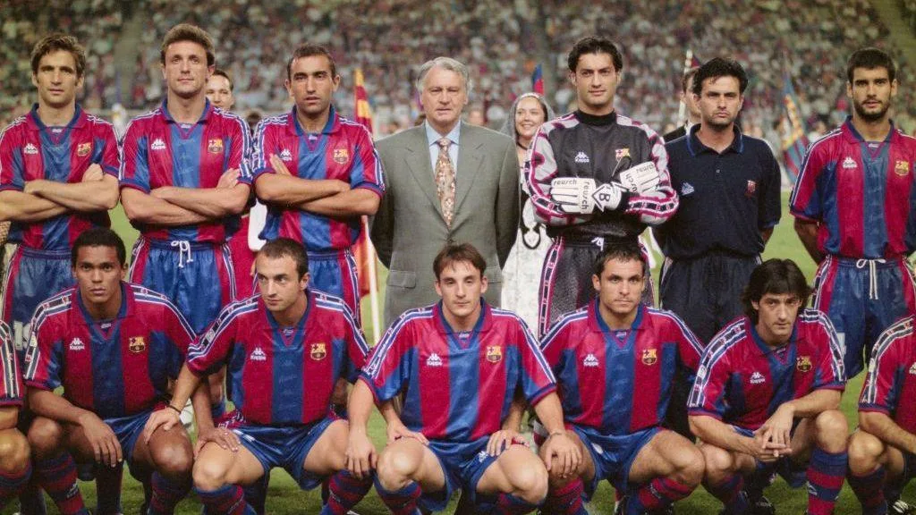 An image from 1996 showing Barcelona head coach Bobby Robson (centre back row) and coach Jose Mourinho (back row 2nd right) posing for a team picture with players including Pep Guardiola (back row right)