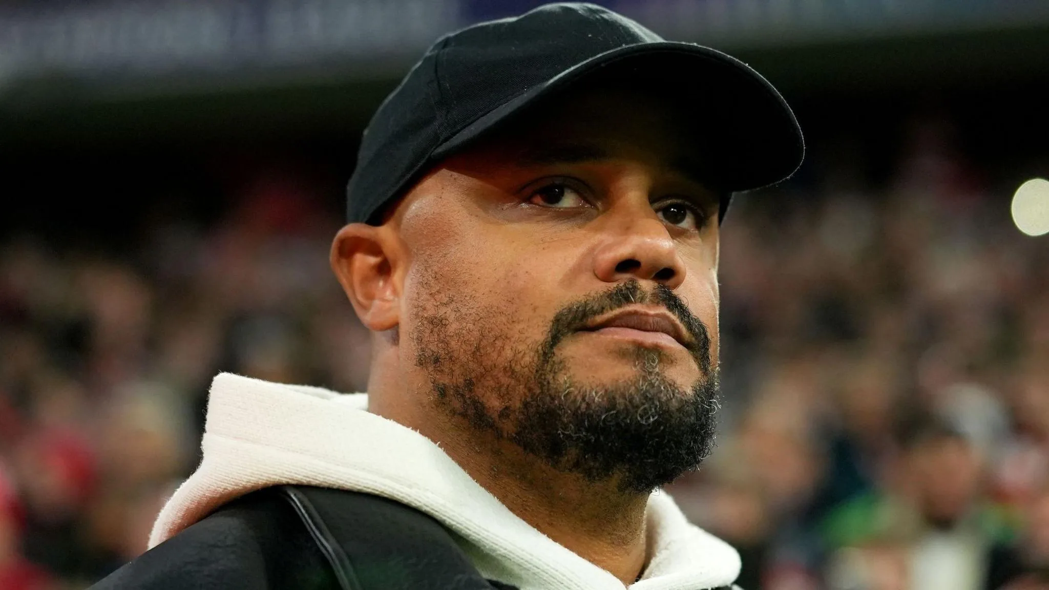 Vincent Kompany watches on during Bayern Munich's Champions League match against Arsenal