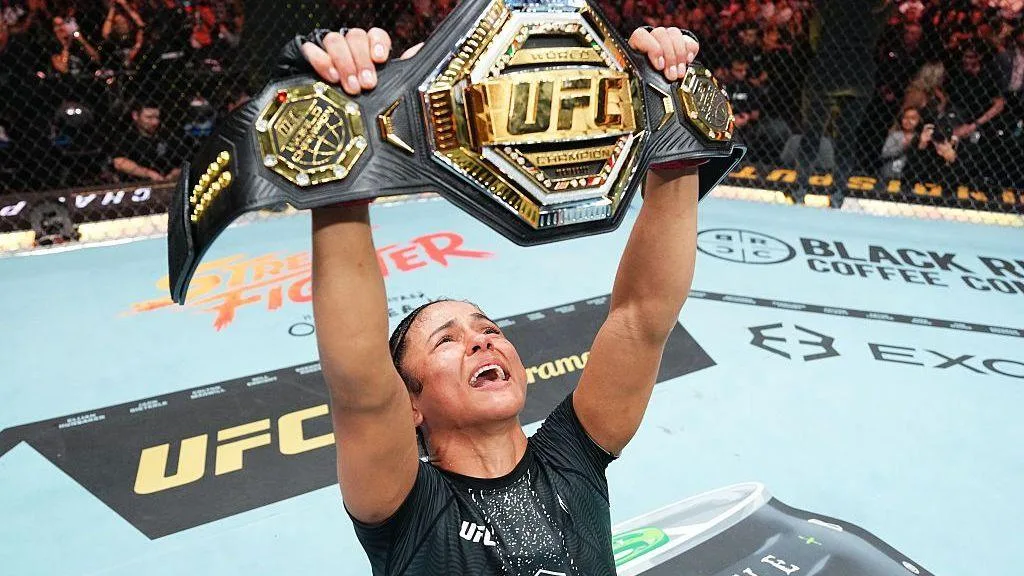 Natalia Silva lifts the UFC 332 flyweight belt