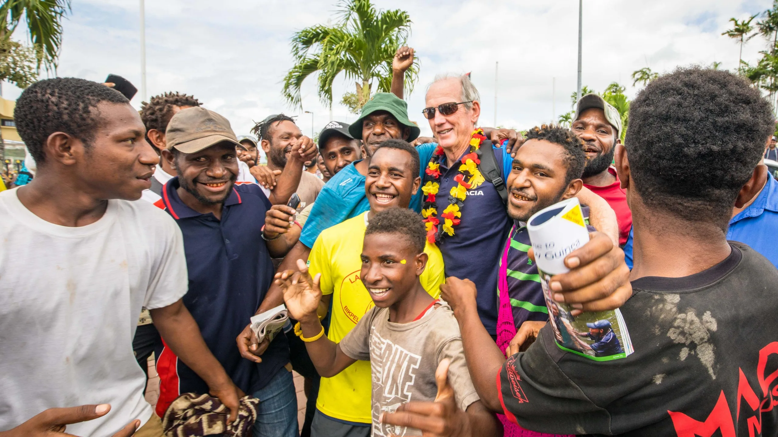 Wayne Bennett being warmly welcomed by Papuan fans
