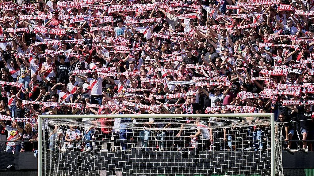 Fans of Rayo Vallecano hold their scarves in protest against Martin Presa, president of Rayo Vallecano 