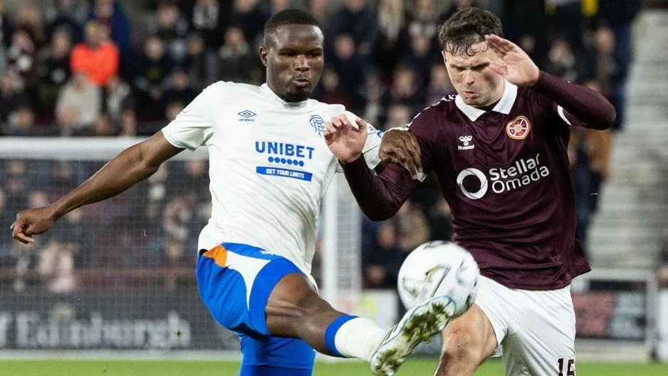 Rangers' Olwethu Makhanya and Heart of Midlothian's Josh McPake in action