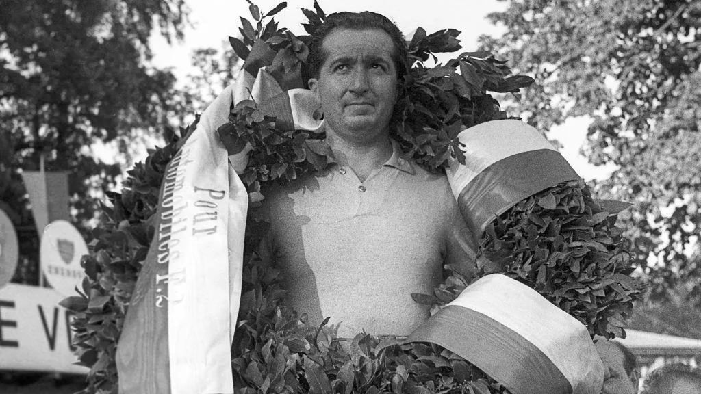 Alberto Ascari with a laurel wreath around his neck after winning the 1953 Swiss Grand Prix in Bremgarten