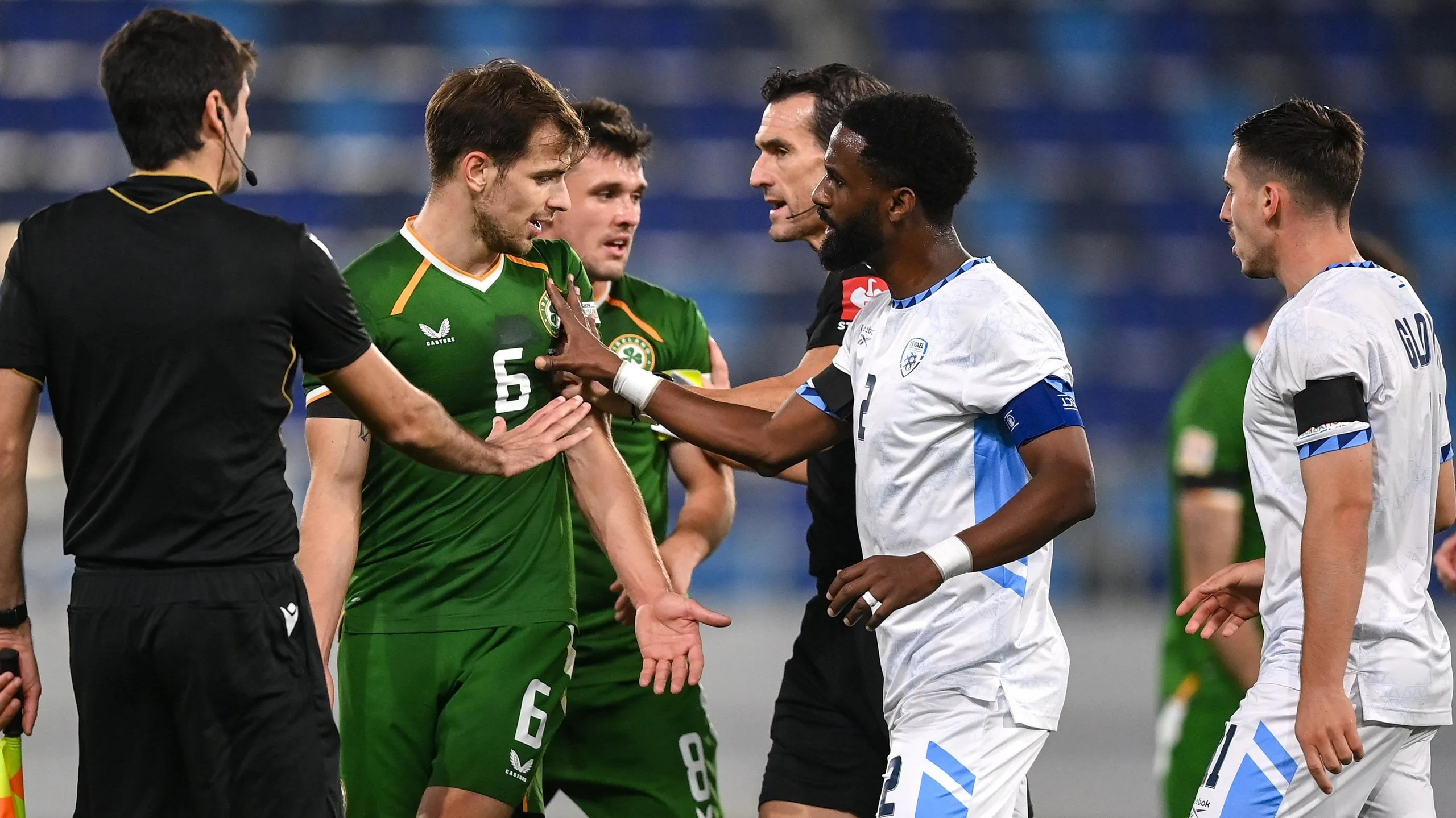 Jayson Molumby and Jason Knight clash with Israel players at full-time