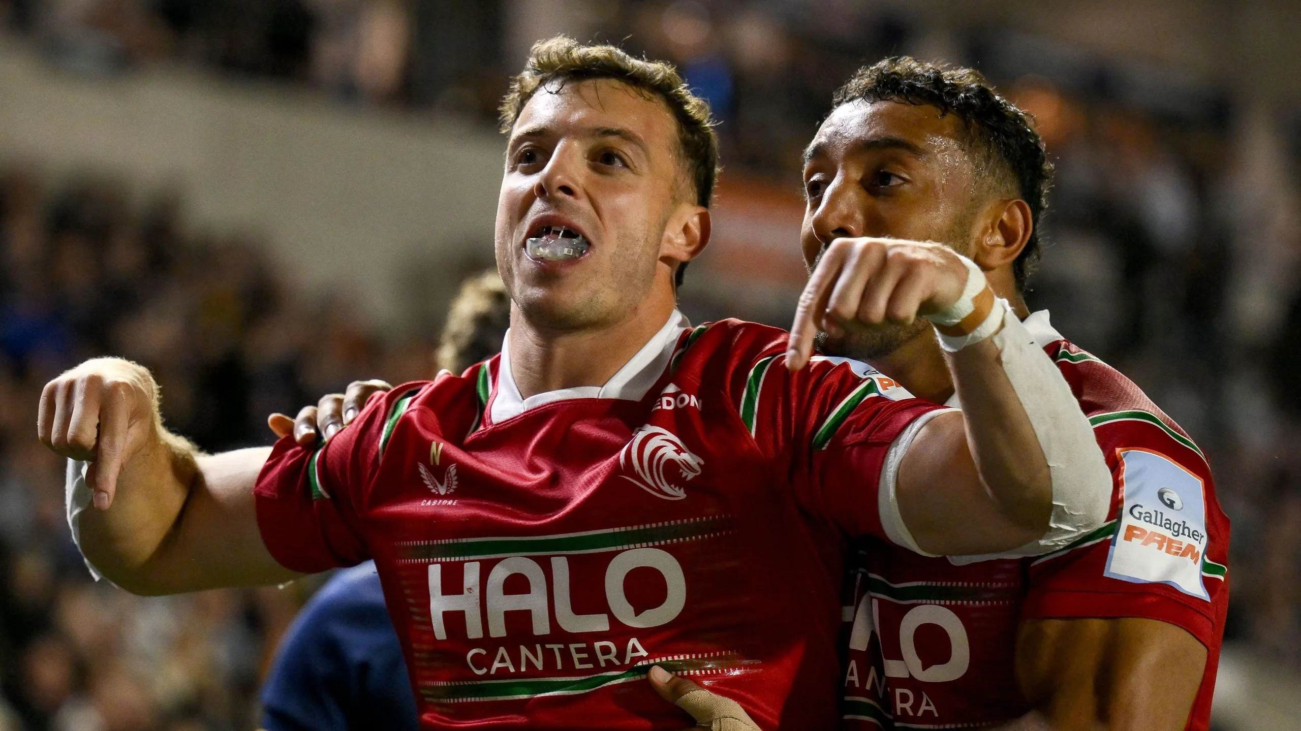 Leicester Tigers' Adam Radwan celebrates scoring a try by holding his hands out with his index fingers downwards