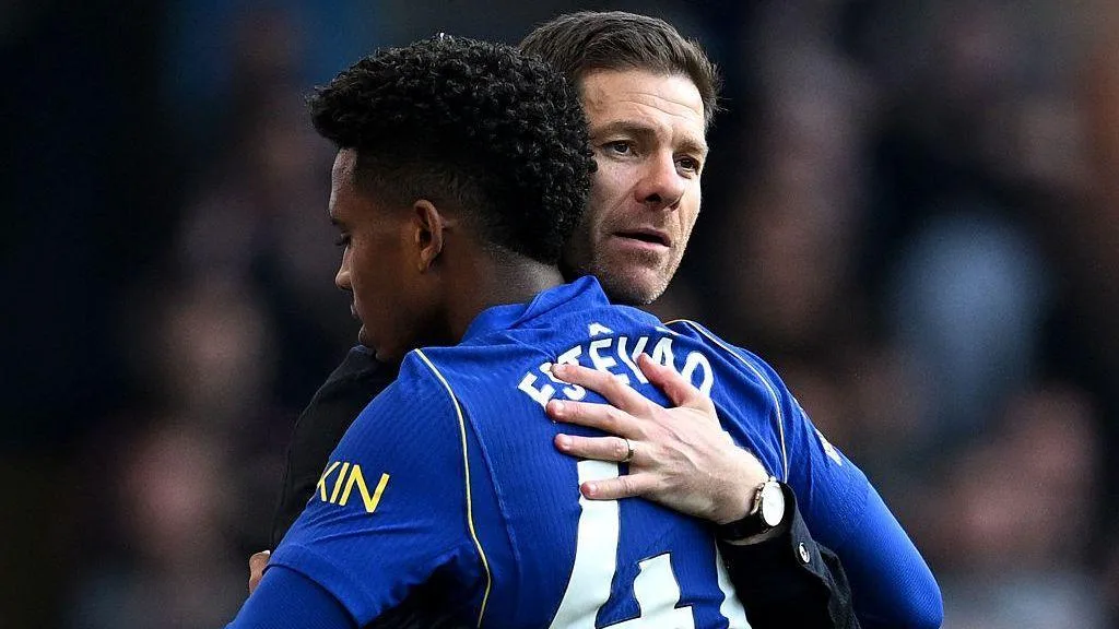Xabi Alonso hugs Estevao Willian