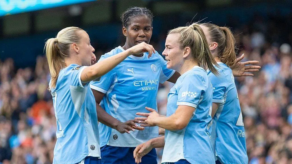 Manchester City players celebrate against Arsenal