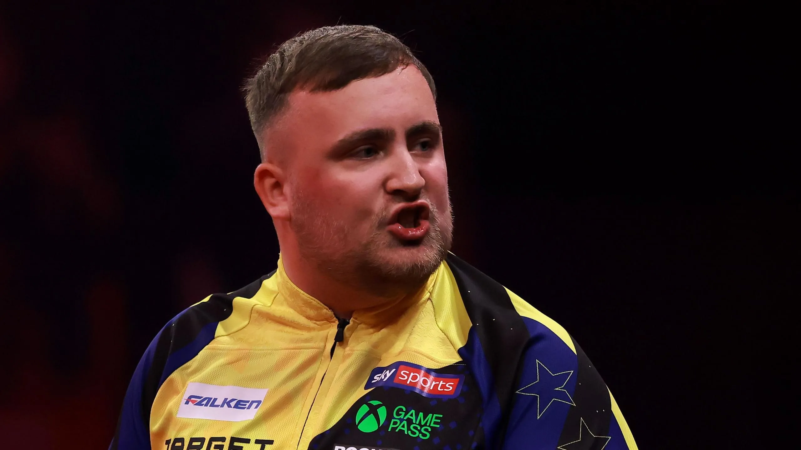 Luke Littler looks frustrated