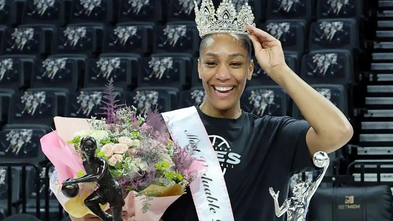 A'ja Wilson poses for photos with her fifth MVP trophy 