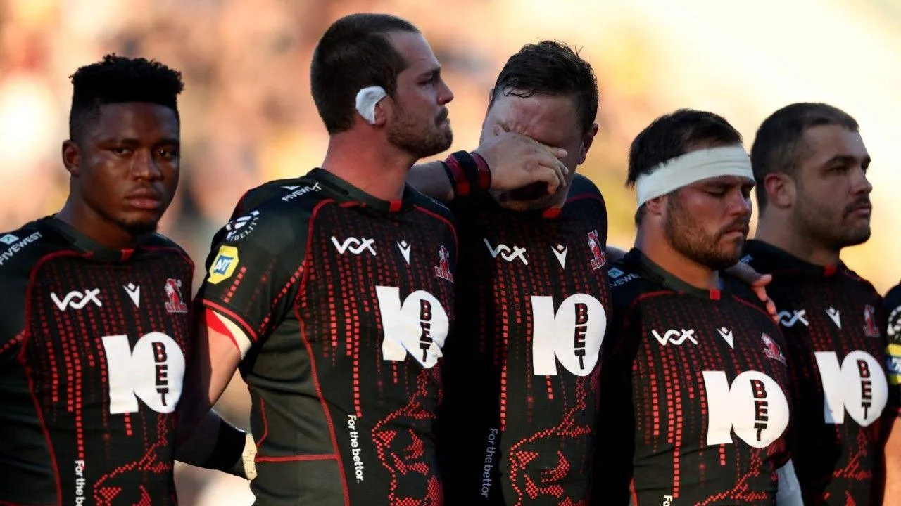 Lions players are emotional during a minute's silence for late team-mate Hyron Andrews