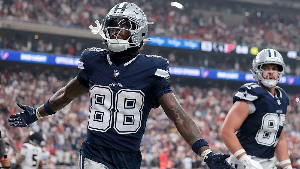 CeeDee Lamb of the Dallas Cowboys celebrates after scoring a touchdown during his team's win against the Houston Texans