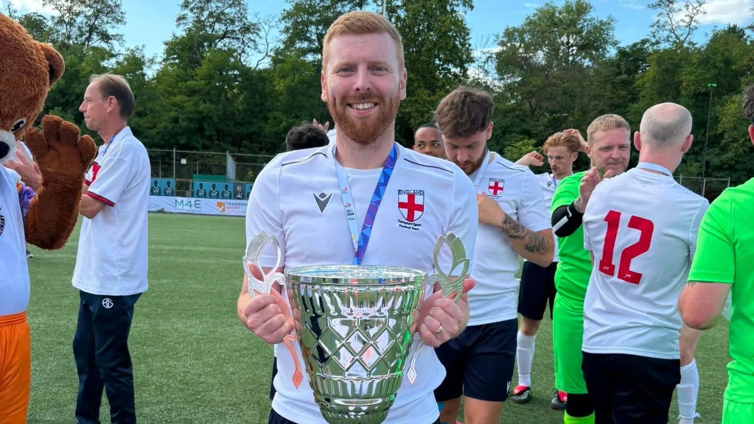 Martyn Jackson poses with the Transplant World Cup trophy