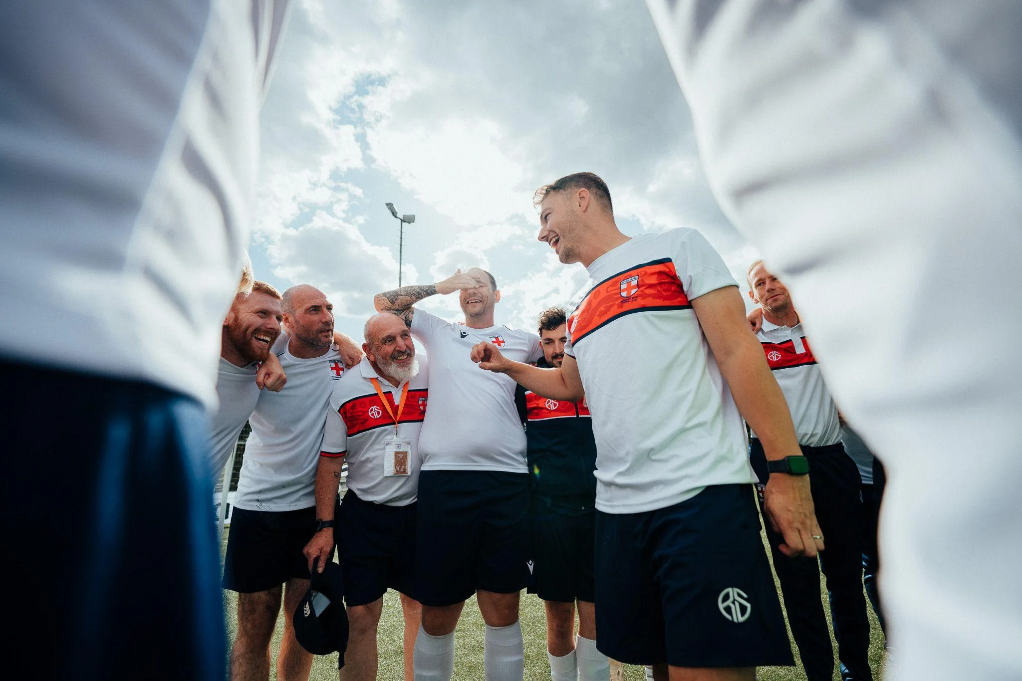 Daley Cross, England transplant team manager, speaks to his players in a huddle after the Transplant World Cup final