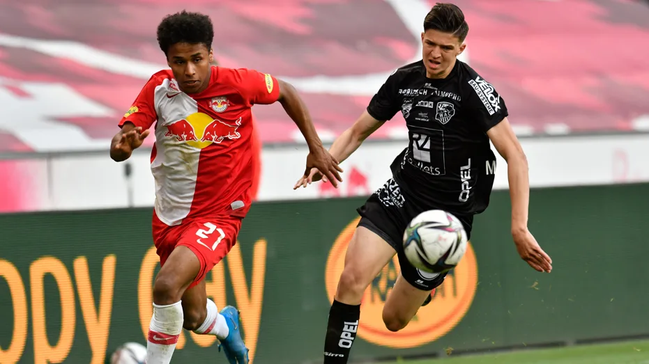 Karim Adeyemi of Red Bull Salzburg and Tarik Muharemovic of Wolfsberger battle for the ball 