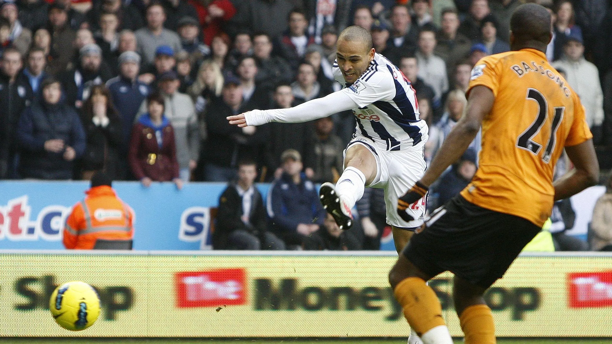 West Bromwich Albion striker Peter Odemwingie fires in his hat-trick goal at Molineux in the Baggies' 5-1 win over Wolves (12 February 2012)