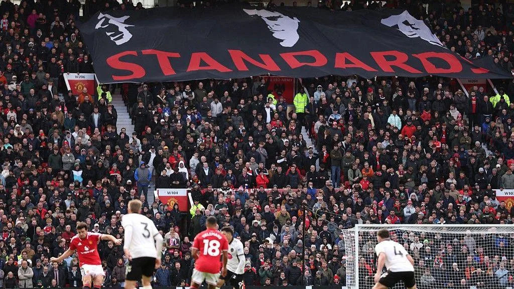 Manchester United fans unfurled a 'Standards' banner during the 3-0 defeat to Bournemouth, showing the images of three legendary captains Bryan Robson, Eric Cantona and Roy Keane