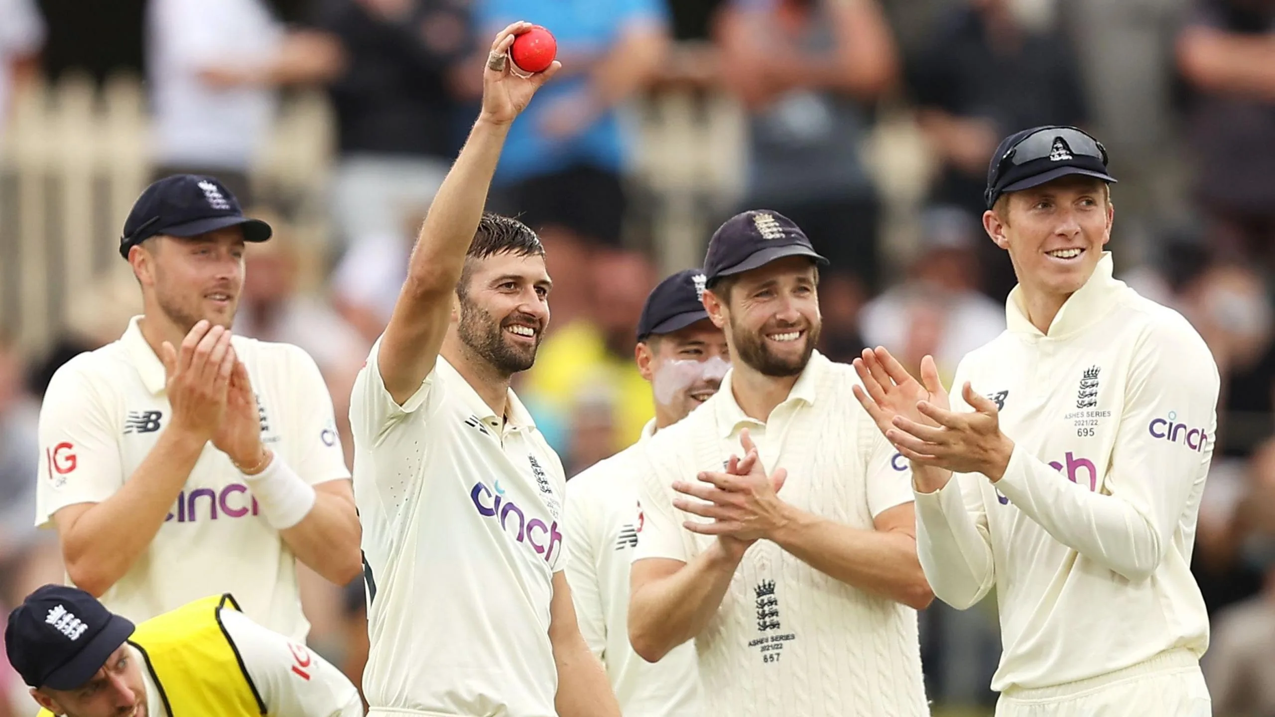 Mark Wood raises ball to crowd after six wickets in Hobart