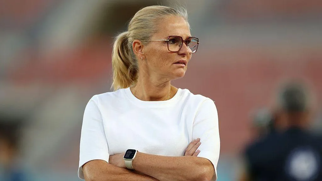 England manager Sarina Wiegman with her arms folded 