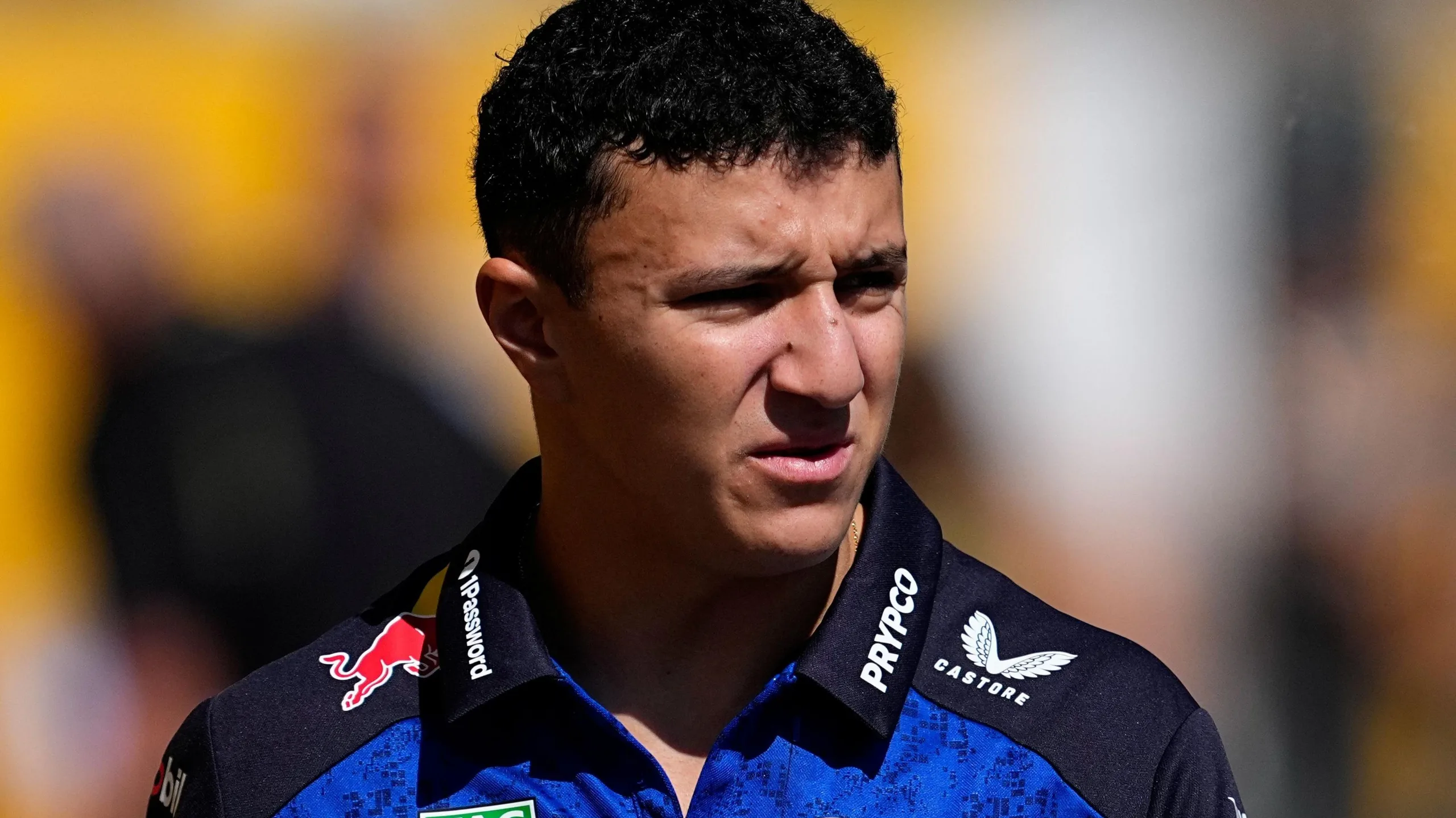 Isack Hadjar wearing a Red Bull polo shirt
