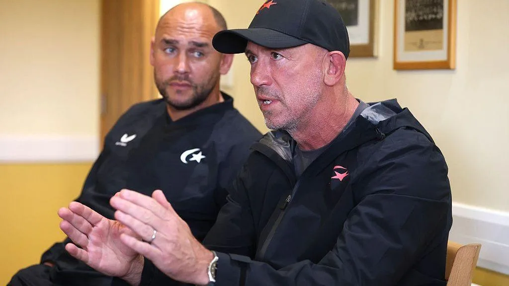 Brendan Venter gesticulates while talking alongside Joe Shaw