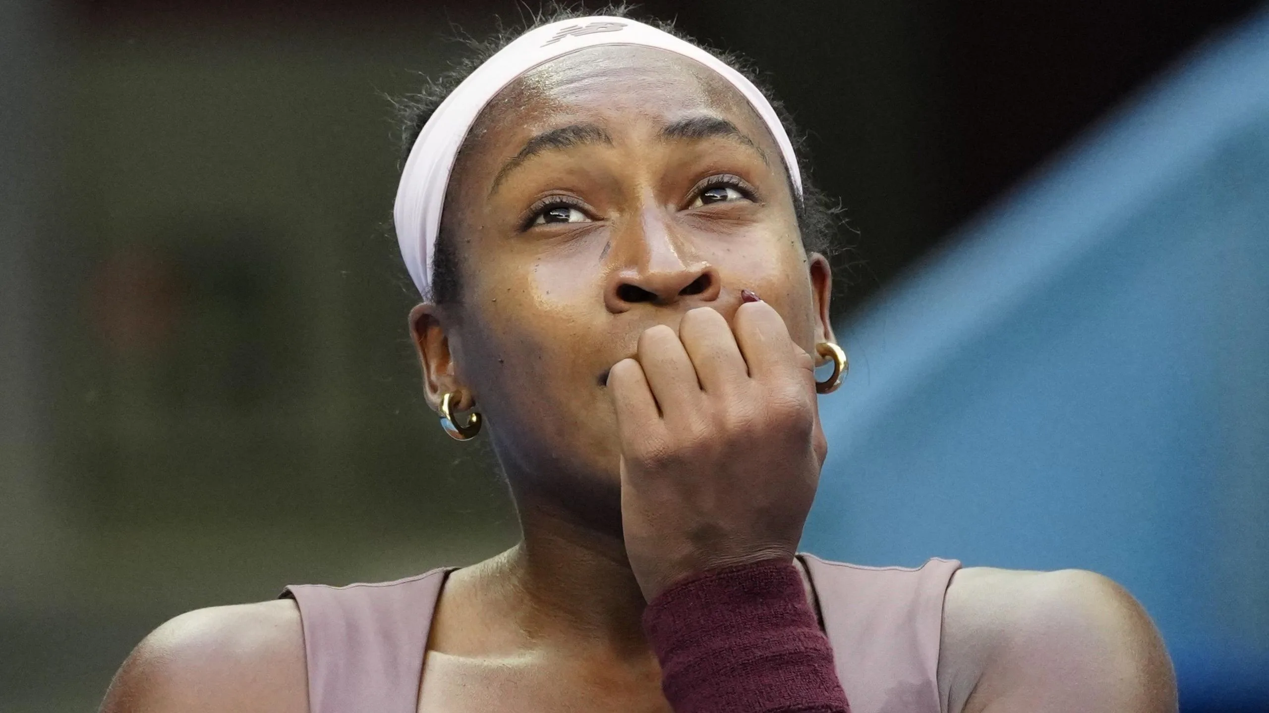 Coco Gauff covers her mouth during her China Open match against Elise Mertens