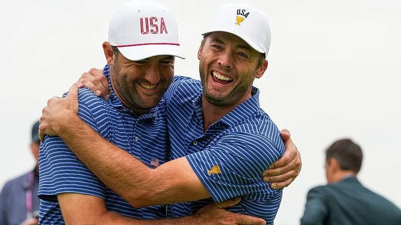 Scottie Scheffler and Sam Burns celebrate
