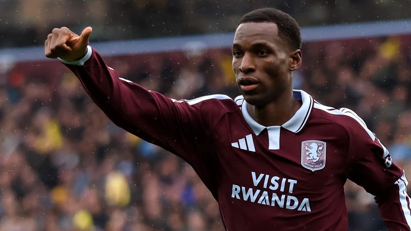 Nicolas Jackson, wearing a claret and blue shirt, celebrates a goal for Aston Villa against Manchester City