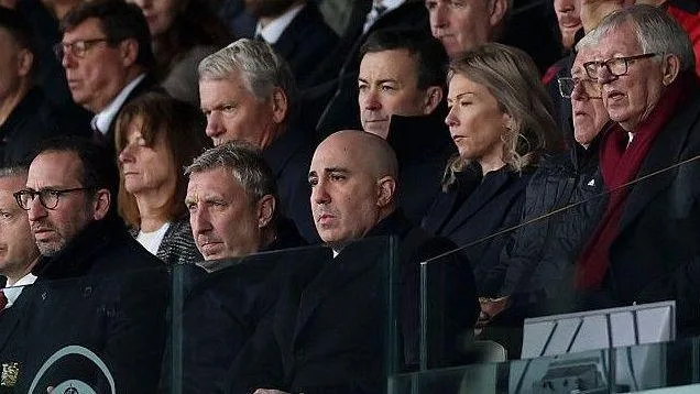 Manchester United executives, with Sir Alex Ferguson, watch the team in action at Leeds United from the stands
