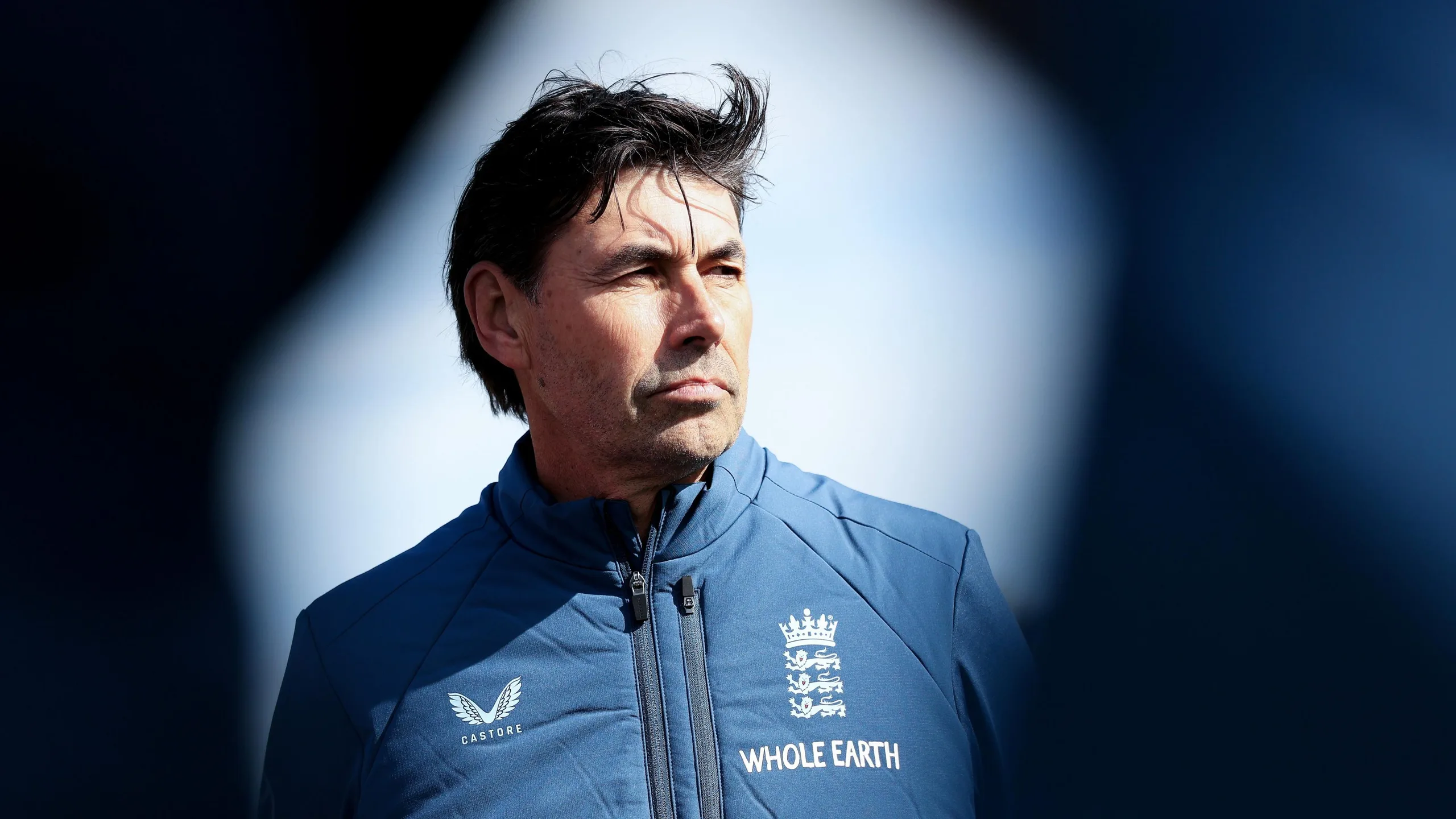 Stephen Fleming looks on, framed by shadows