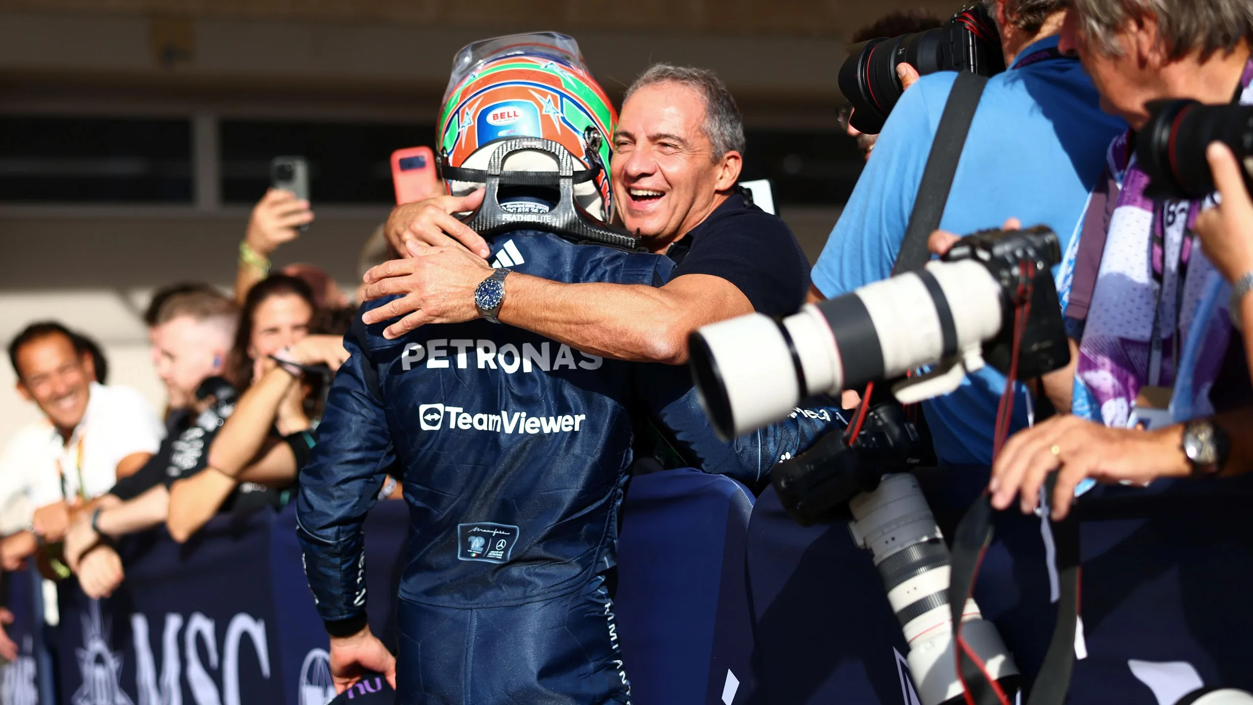 Kimi Antonelli and his father, Marco, hug after the Italian claimed pole position in Austin 