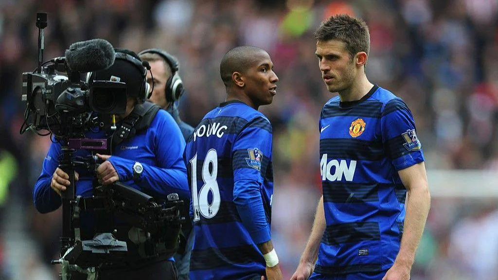 Michael Carrick and Manchester United team-mate Ashley Young on the pitch at Sunderland in 2012