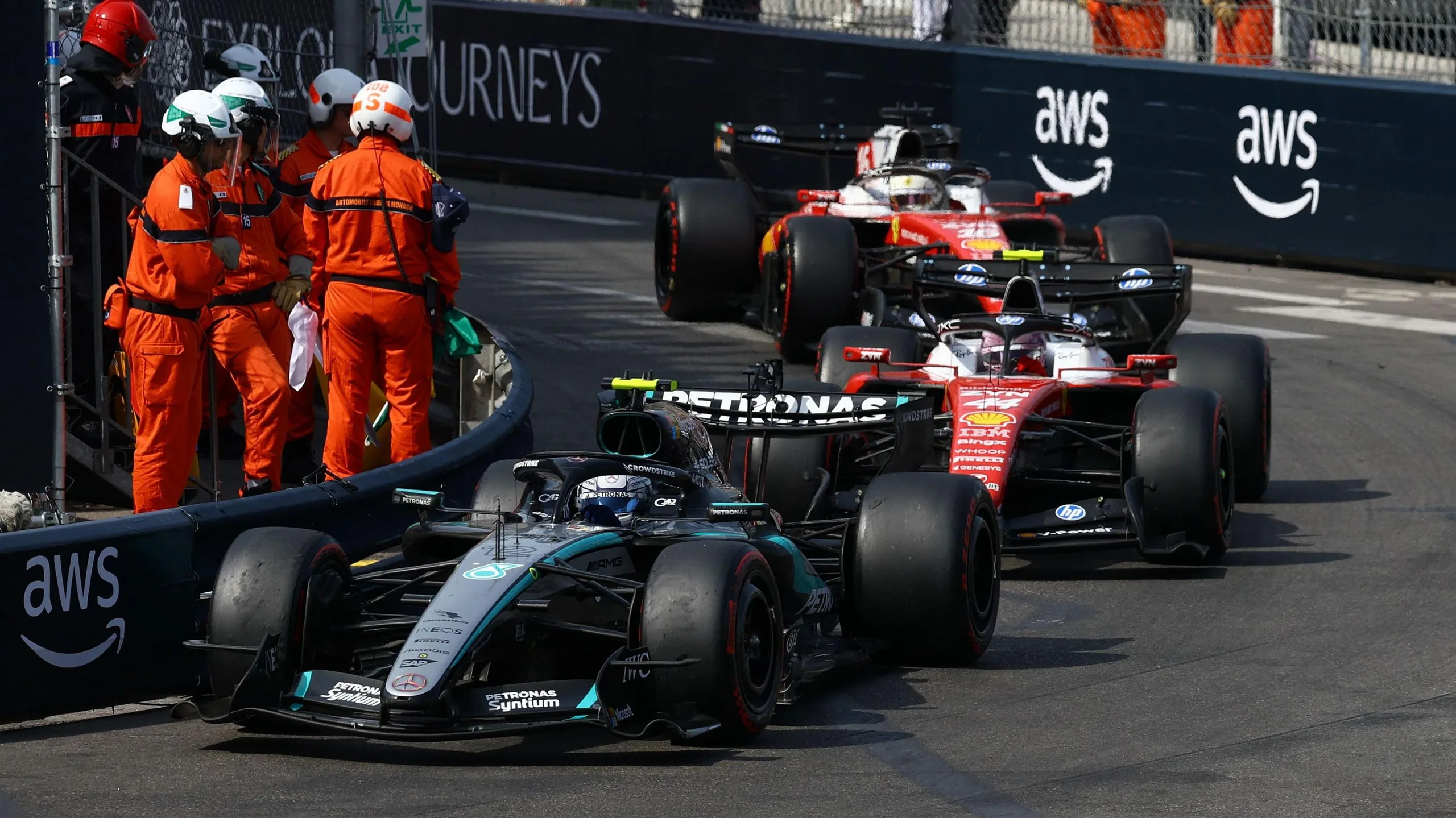 Kimi Antonelli leading the 2026 Monaco Grand Prix with Ferrari drivers Lewis Hamilton and Charles Leclerc following immediately behind him