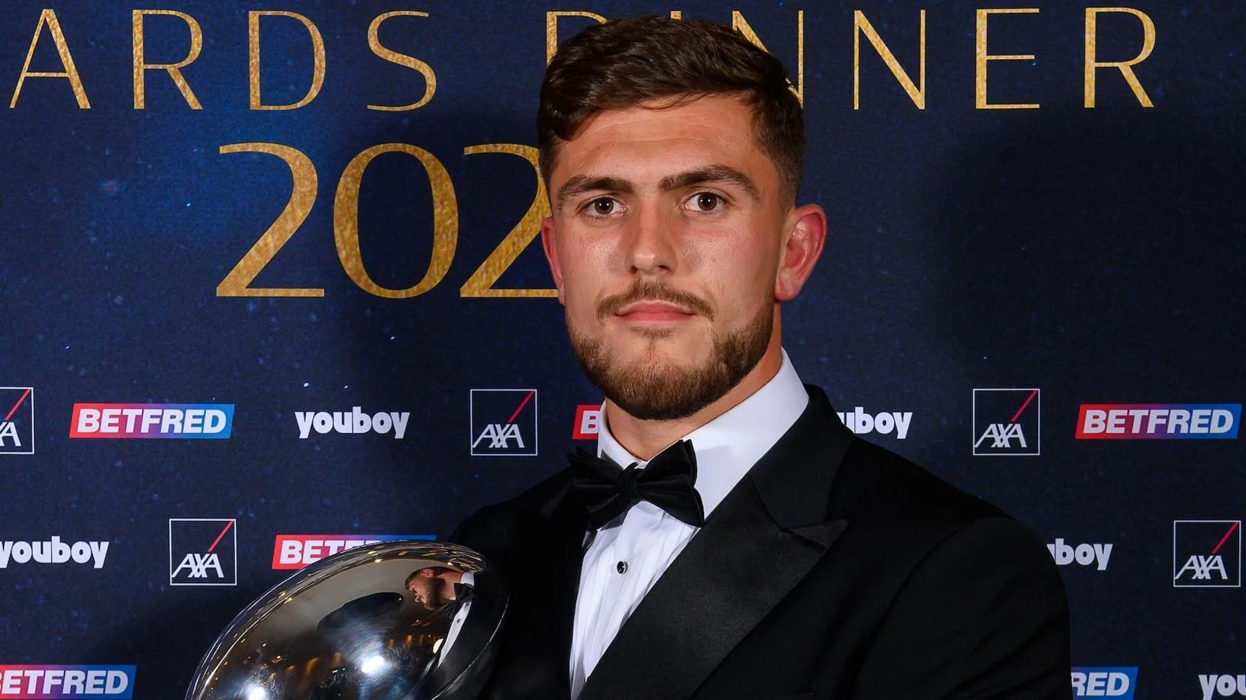 Brad O'Neill of Wigan Warriors poses with a trophy at the RFL Awards dinner
