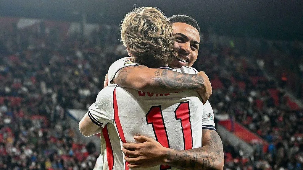 Morgan Rogers celebrates with Anthony Gordon. 