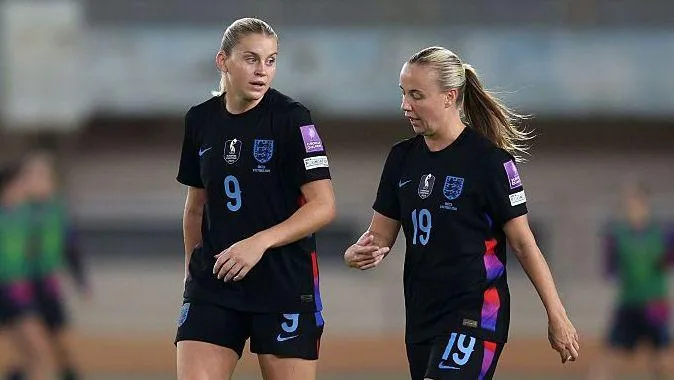 Alessia Russo and Beth Mead talking while playing for England