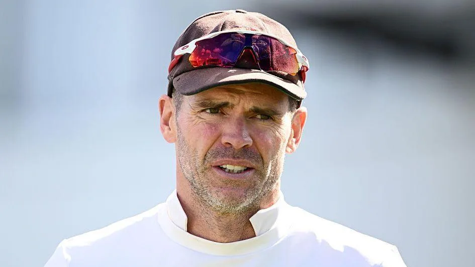 James Anderson wearing a cap with sunglasses on the brim