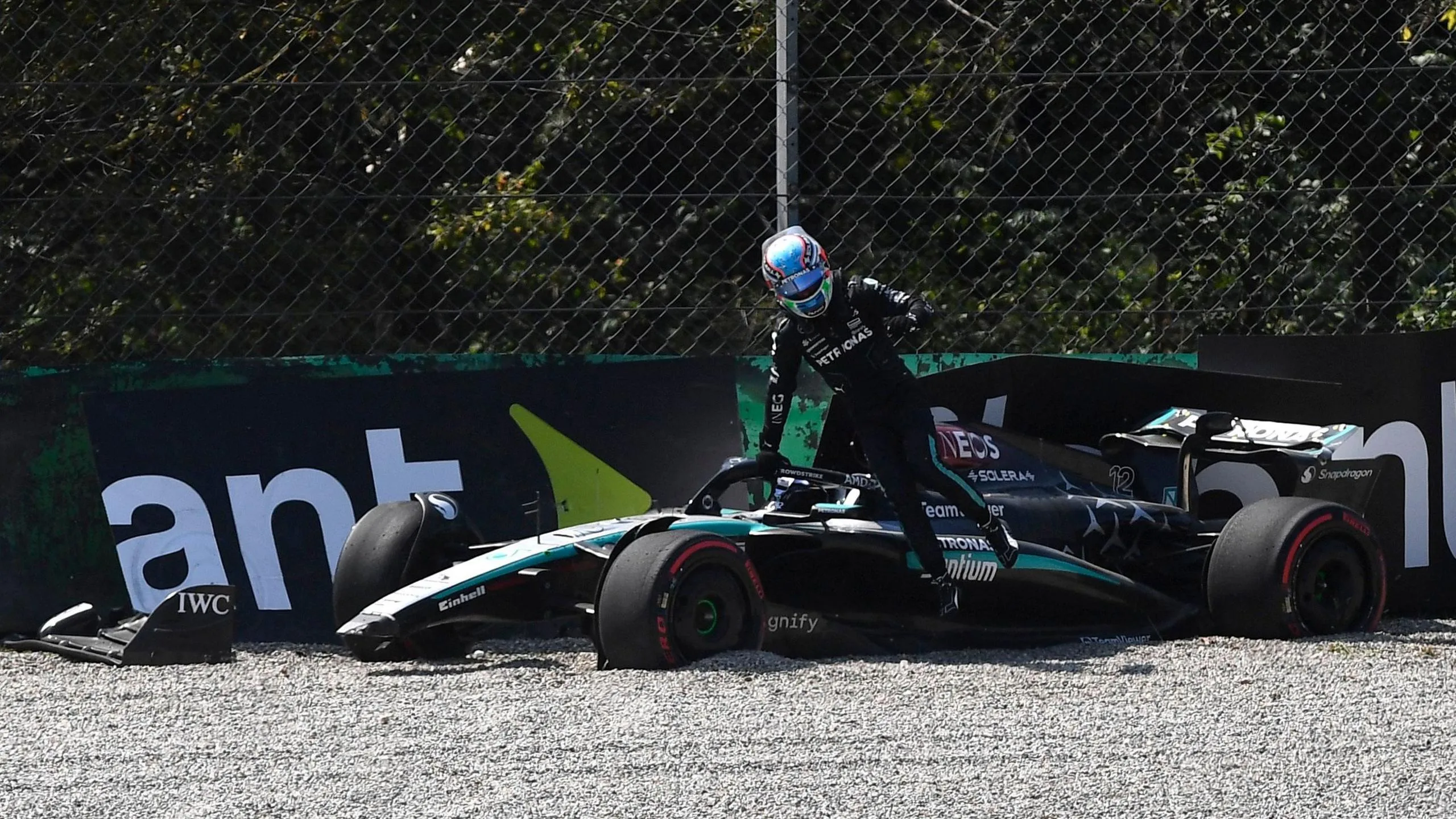 Kimi Antonelli climbs out of his Mercedes after crashing in first practice for the 2024 Italian Grand Prix at Monza
