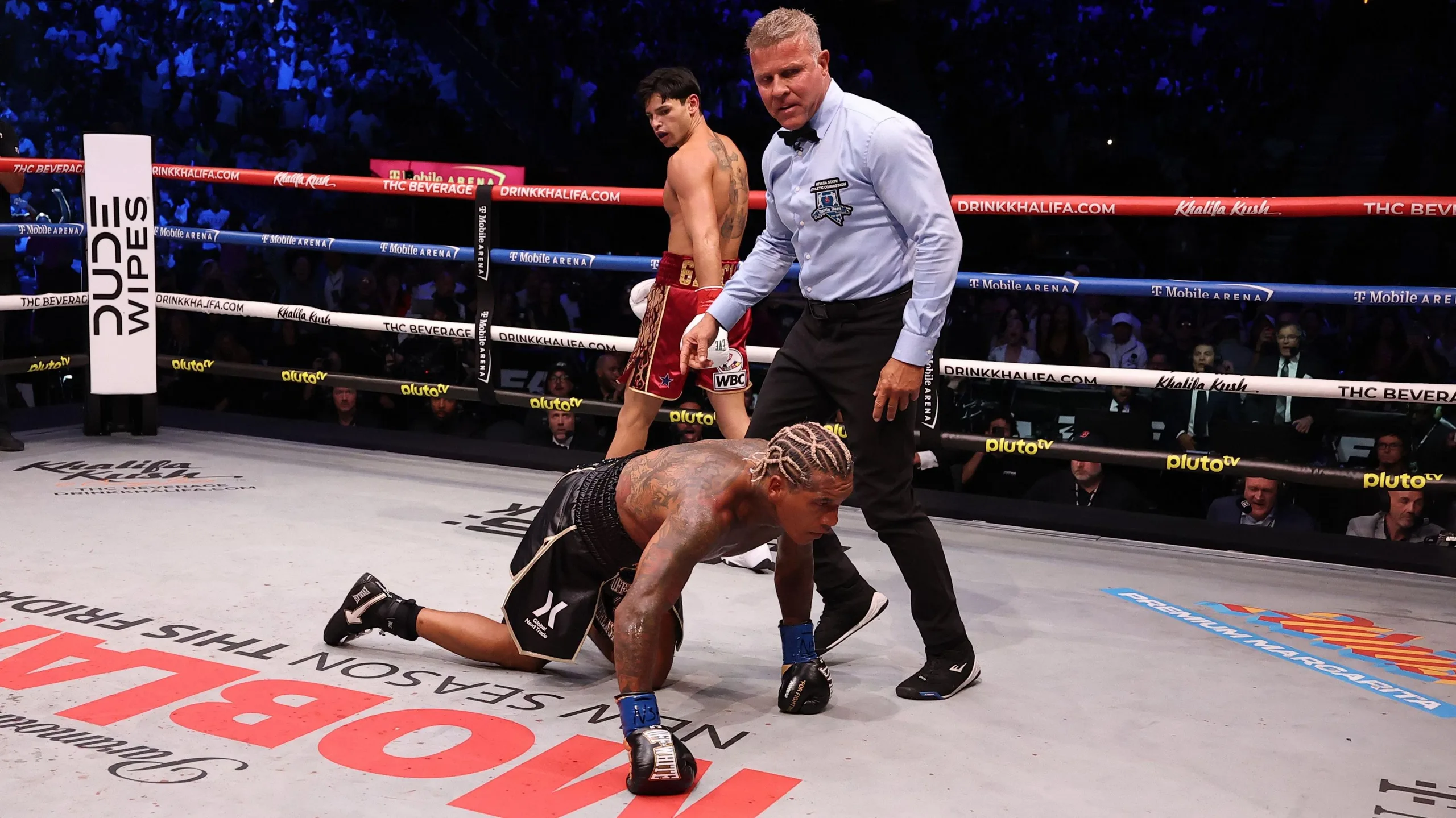 Conor Benn puts his hands down on the canvas
