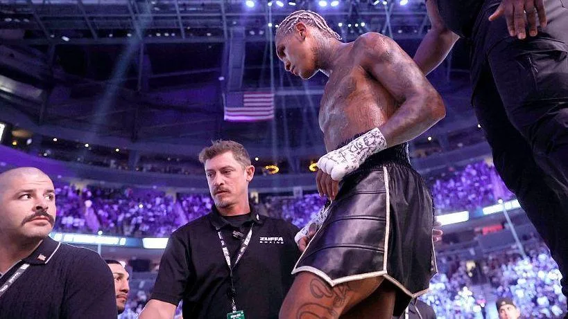 Conor Benn is wearing black shorts as he walks out the ring