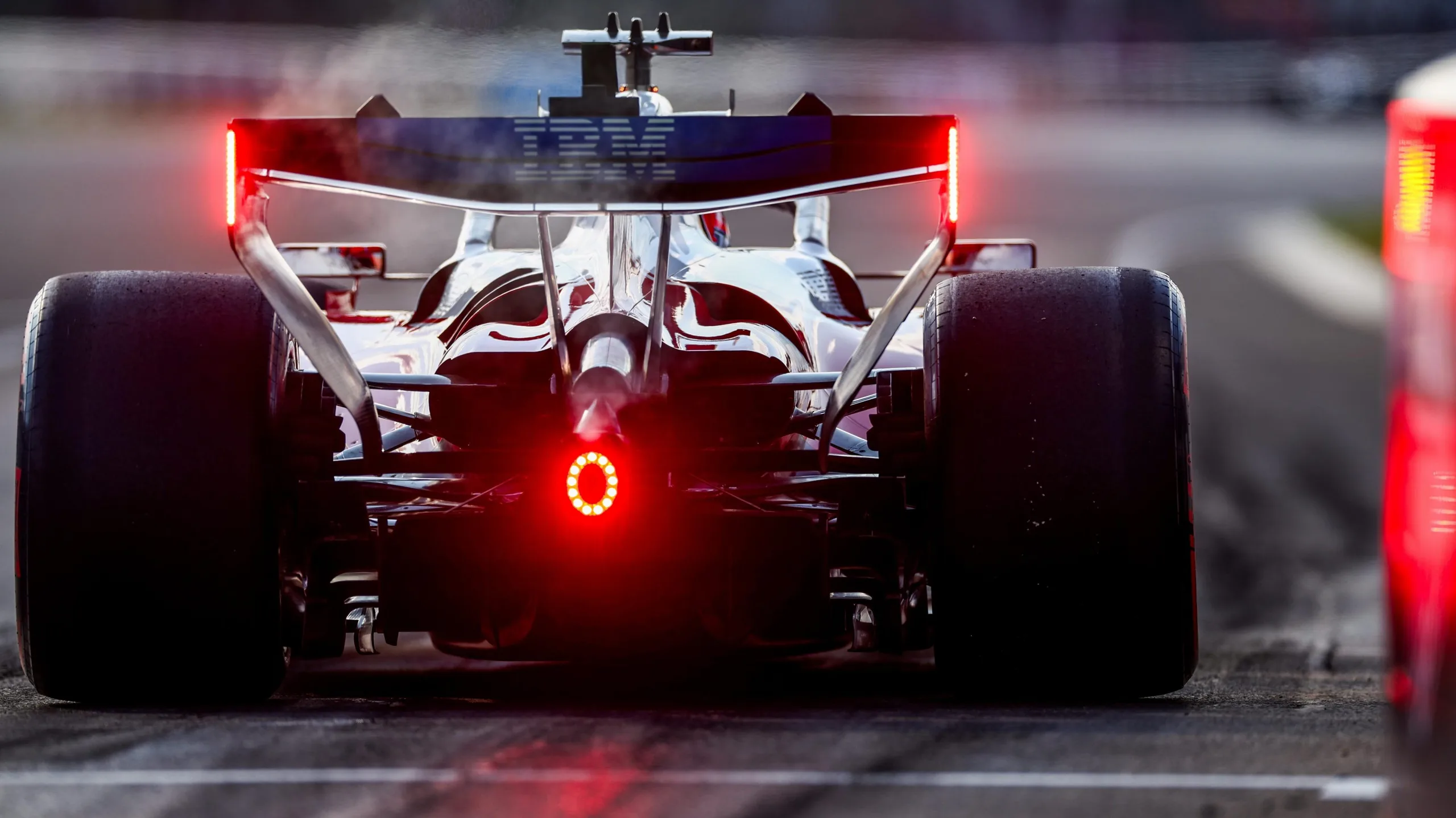 Charles Leclerc's Ferrari accelerates out of the pits at the 2026 Hungarian Grand Prix