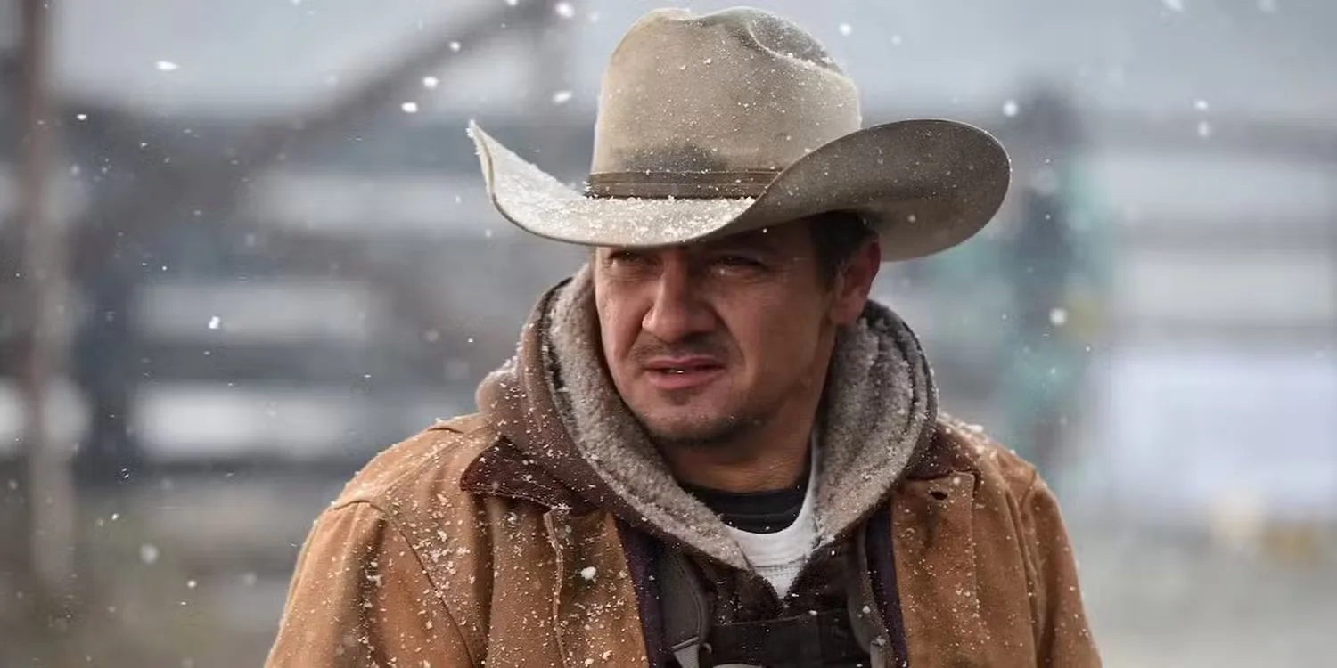 Jeremy Renner as Cory Lambert staring off into the snow in Wind River