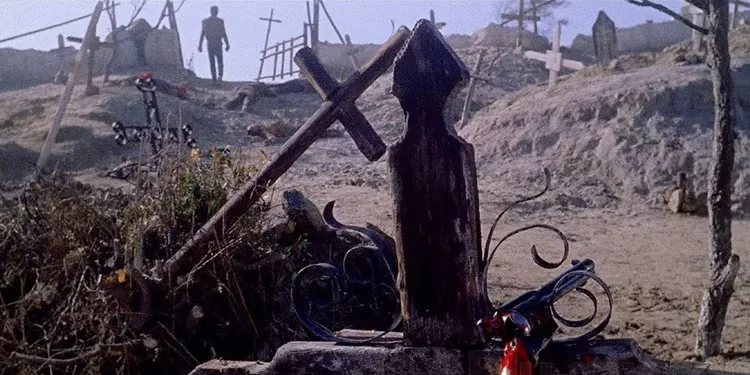 Django (Franco Nero) walks away from his bloody gun at the end of 'Django' (1966)