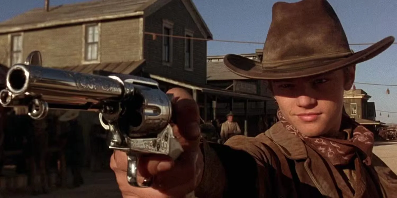 Leonardo DiCaprio as The Kid pointing a gun at a target offscreen in The Quick and the Dead (1995)