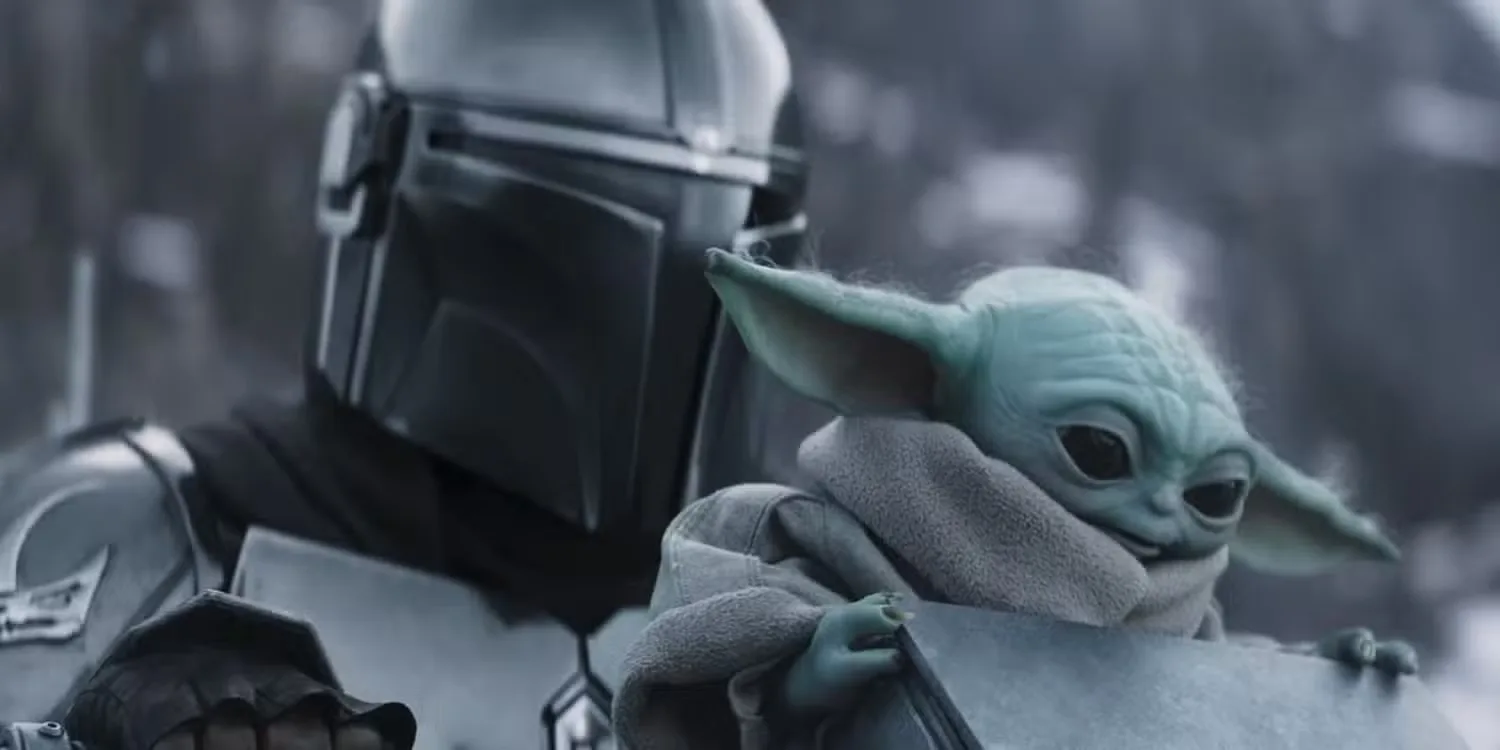 STAR WARS: THE MANDALORIAN AND GROGU, from left: Pedro Pascal as The Mandalorian / Din Djarin, Grogu, 2026. © Walt Disney Studios Motion Pictures / Courtesy Everett Collection
