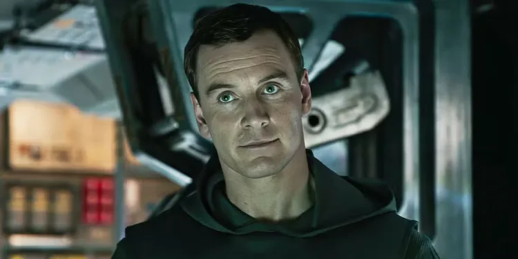 Michael Fassbender smiles slightly aboard a spacecraft in 'Alien Covenant'