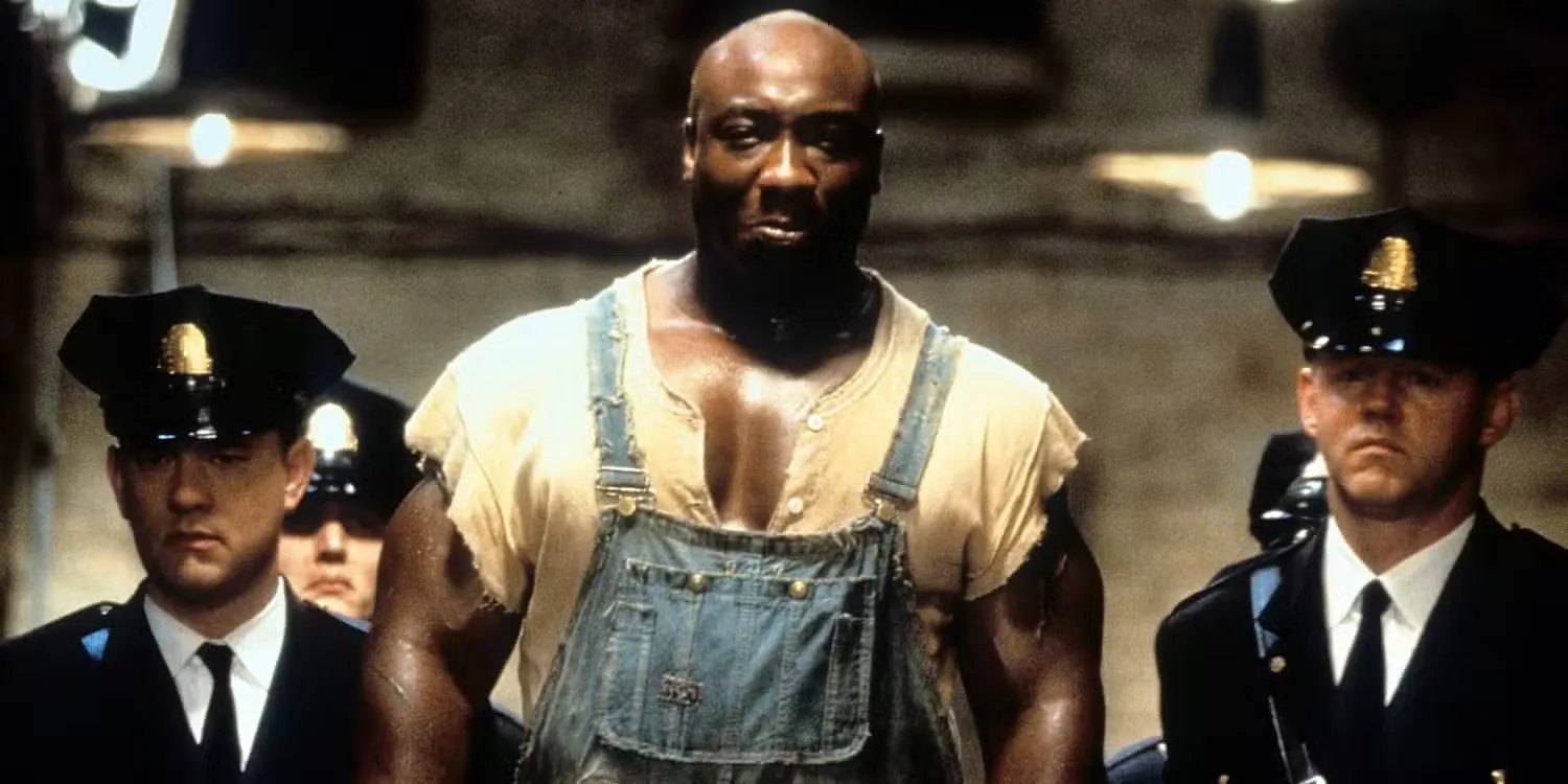 Officers walking John Coffey down a hallway in The Green Mile