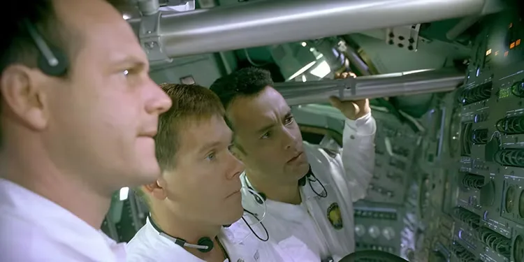 The crew seen looking at a control panel in Apollo 13. - Kevin Bacon, Bill Paxton & Tom Hanks
