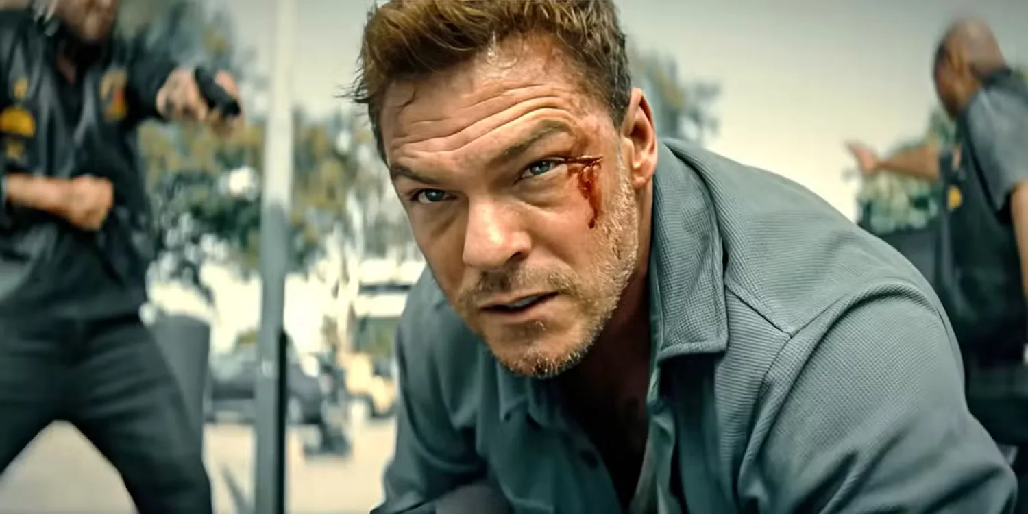 Alan Ritchson with a cut on the left side of his face in Runner