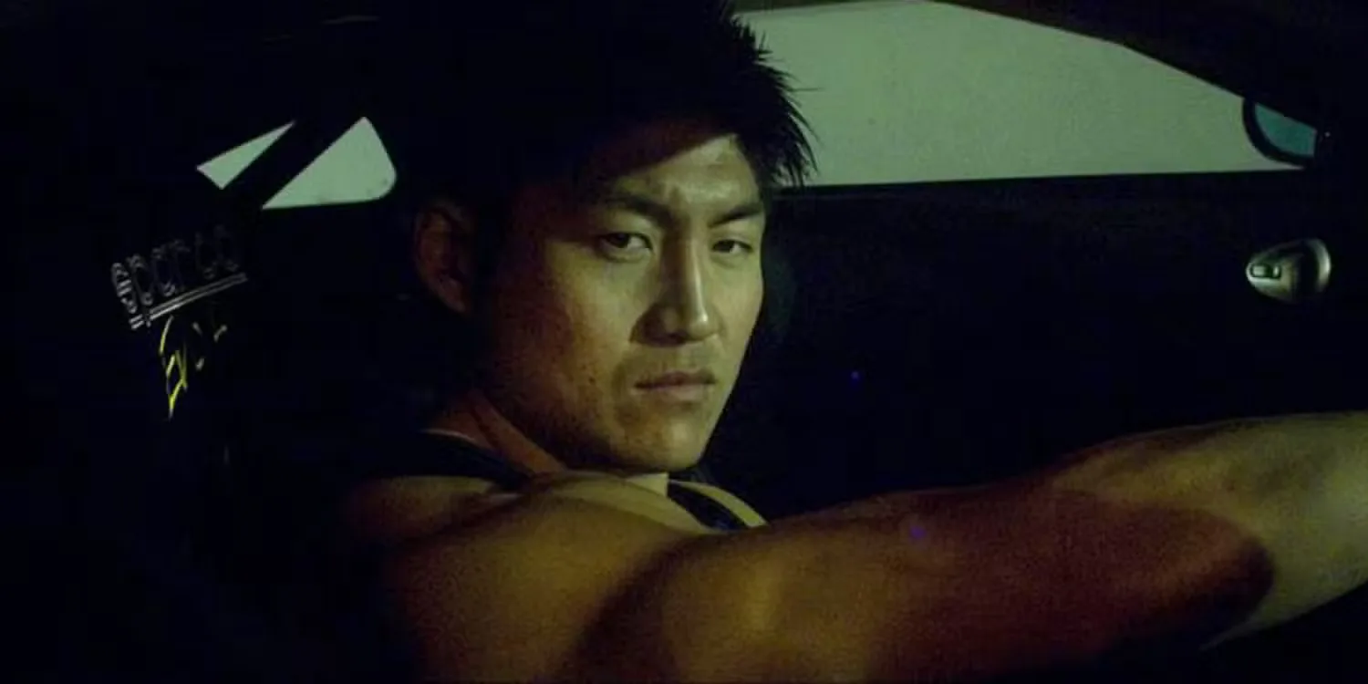 Brian Tee as Takashi or DK stares menacingly out the window of a car in The Fast and the Furious: Tokyo Drift.